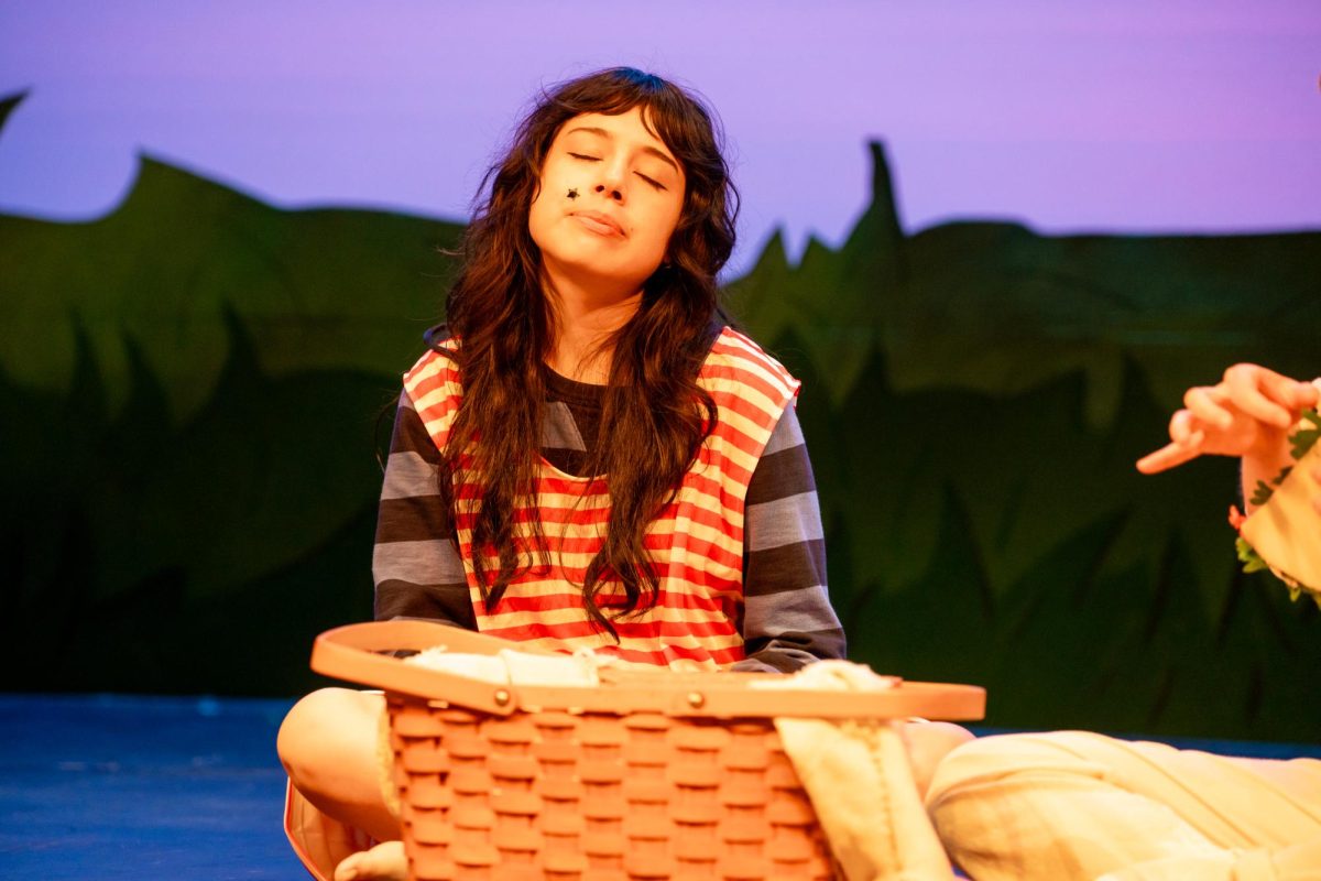 NW Student Annalie Herrera plays Otter in a picnic scene for "The Wind in the Willows" Oct. 2. 
