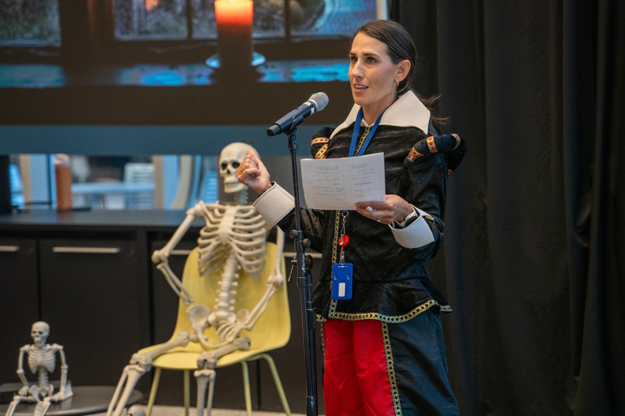 NW English instructor Madison Gillespie gives opening 
remarks about the Dead Writers Night event Oct. 22.