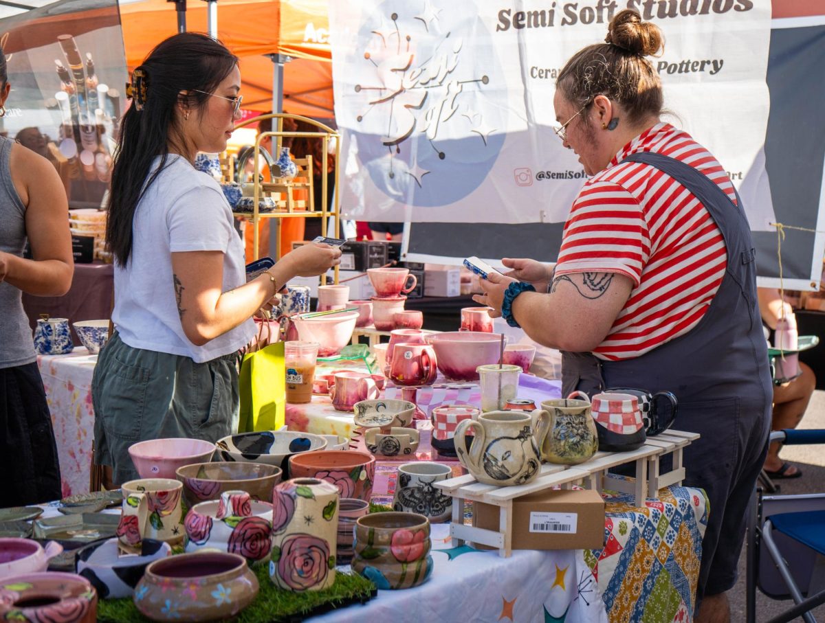 SE Campus visual arts adjunct J.C. Neihardt sells handmade ceramics to customers, Oct. 11 at the Fort Worth Community market.
