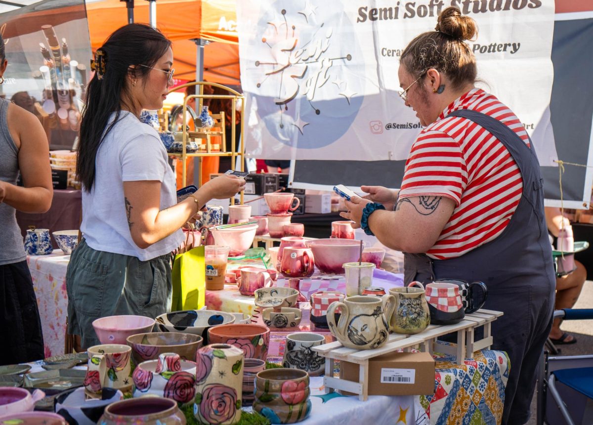 SE Campus visual arts adjunct J.C. Neihardt sells handmade ceramics to customers, Oct. 11 at the Fort Worth Community market.
