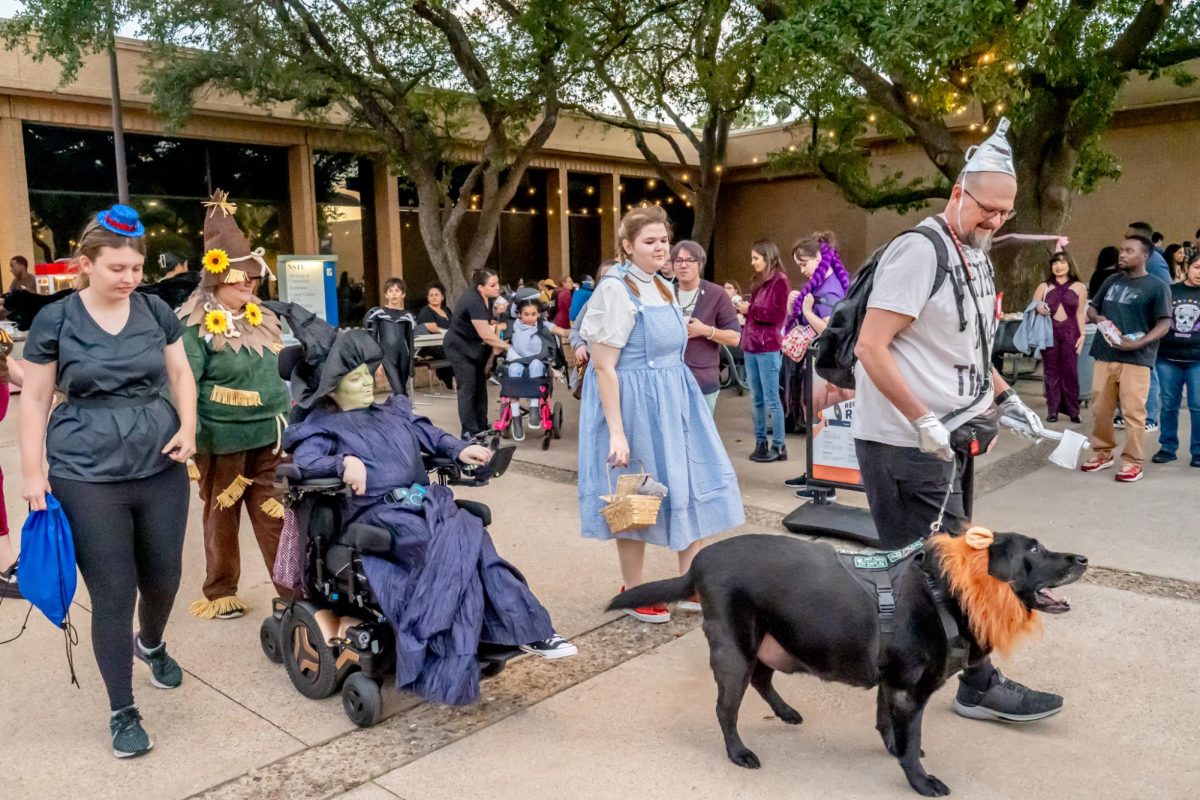 Emily Rowan, Brandy Lasater, Hannah Weiss, Emma Lasater, Josh Lasater and 
Emma’s service dog Frazier Joe attended as characters from “The Wizard of Oz.”