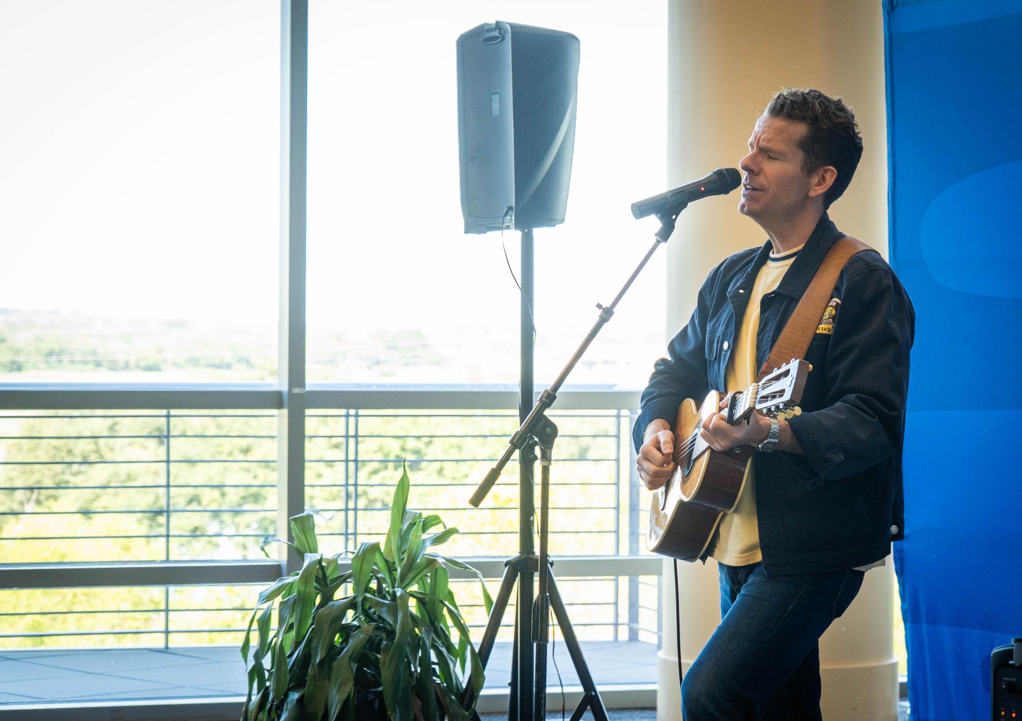 Fort Worth musician Joseph Neville perform one of his songs Oct. 20 at the Backstage Pass event in the Riverfront Cafe on TR Campus. 